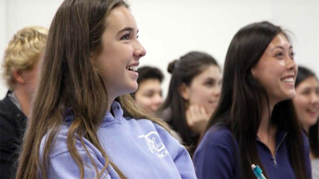students involved in discussion in science classroom