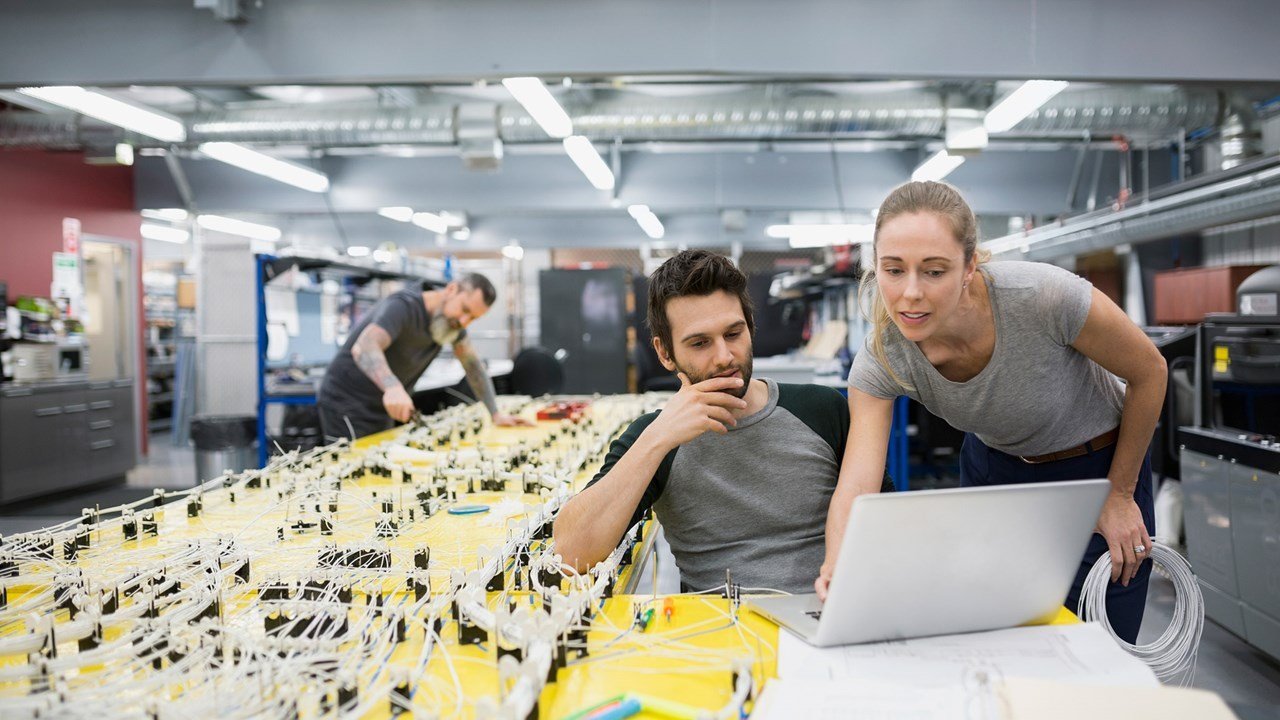 Ocean Technical Support Team looking at laptop