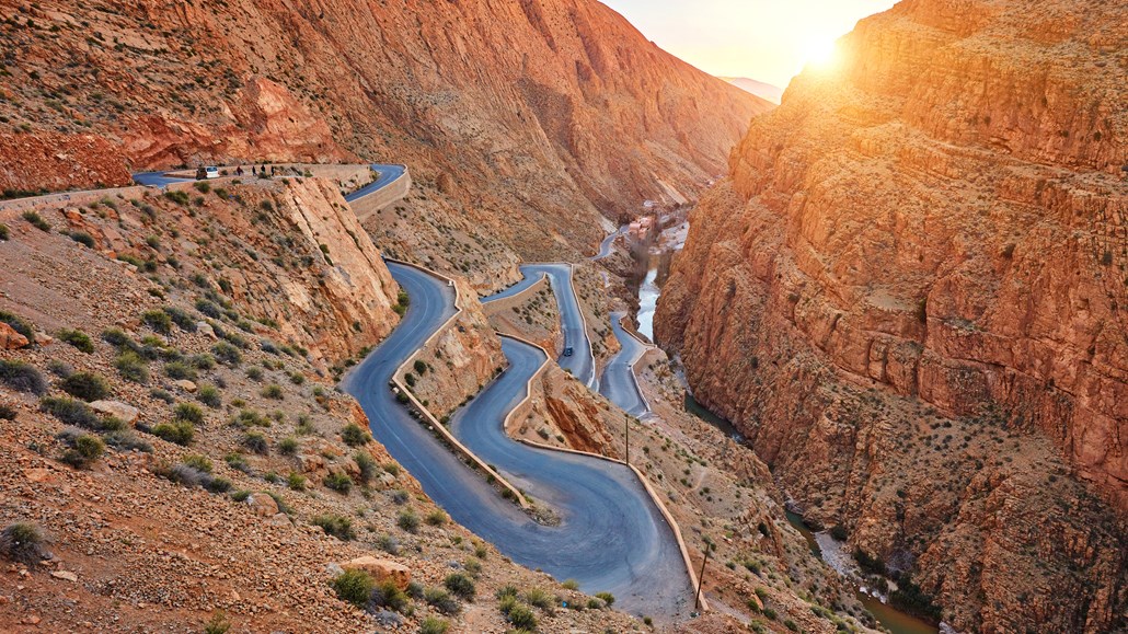 windy road through rock mountains